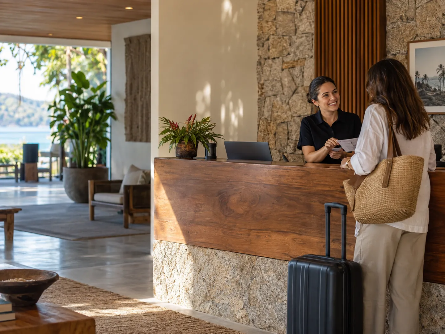 Receptionist welcoming a guest at a hotel
